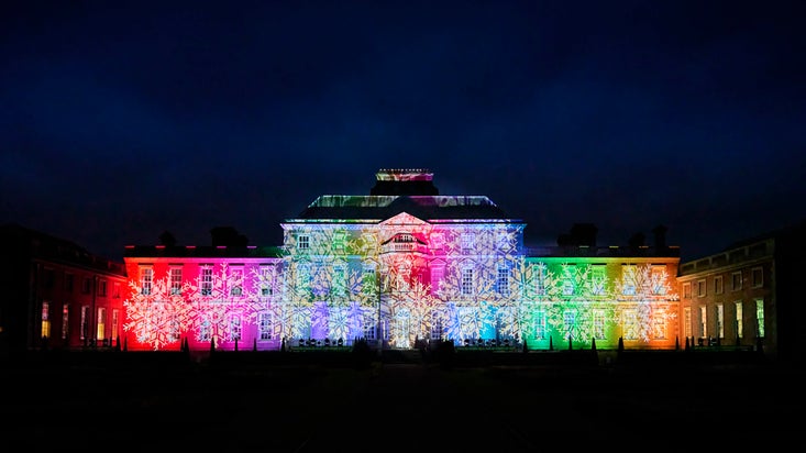 A view of Wimpole House illuminated as part of the Christmas light trail